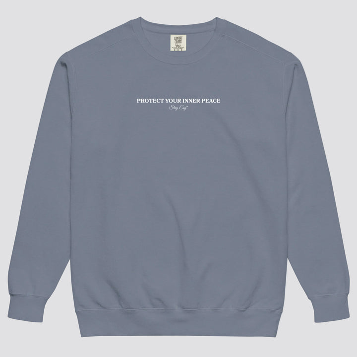 Blue Jean unisex sweatshirt small "Protect your inner peace"graphic text in the middle of chest with "Stay Esy" trademark in script font underneath.