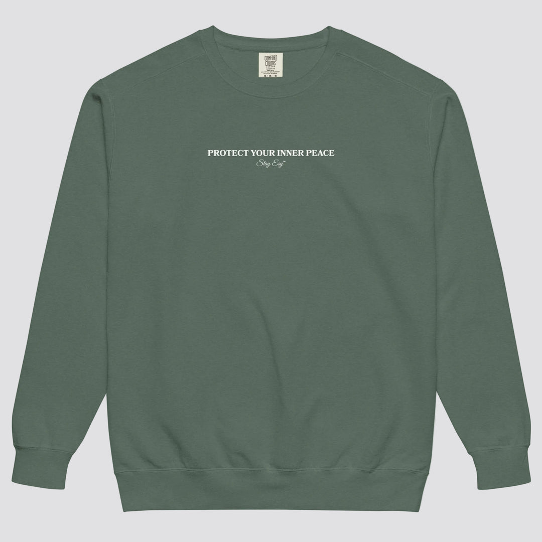 Blue Spruce unisex sweatshirt small "Protect your inner peace"graphic text in the middle of chest with "Stay Esy" trademark in script font underneath.