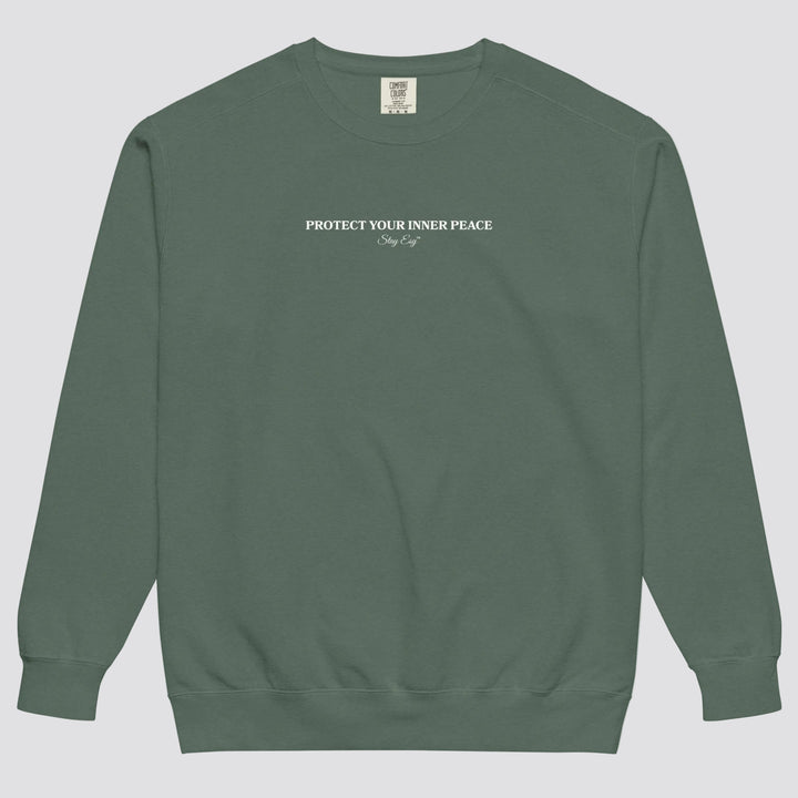 Blue Spruce unisex sweatshirt small "Protect your inner peace"graphic text in the middle of chest with "Stay Esy" trademark in script font underneath.