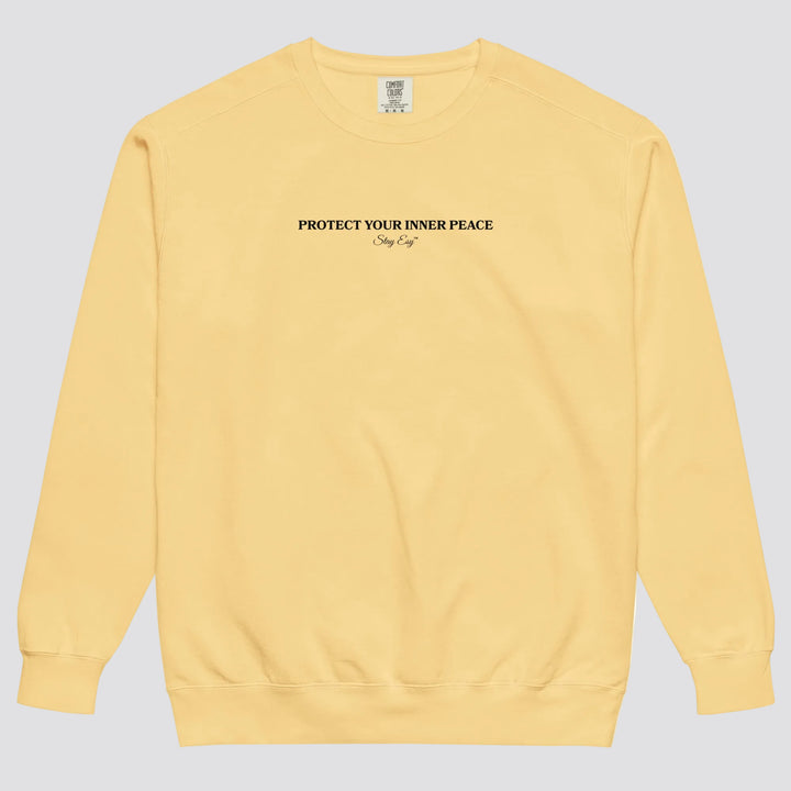 Butter unisex sweatshirt small "Protect your inner peace"graphic text in the middle of chest with "Stay Esy" trademark in script font underneath.