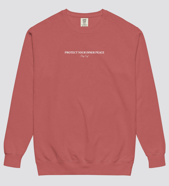Crimson unisex sweatshirt small "Protect your inner peace"graphic text in the middle of chest with "Stay Esy" trademark in script font underneath.