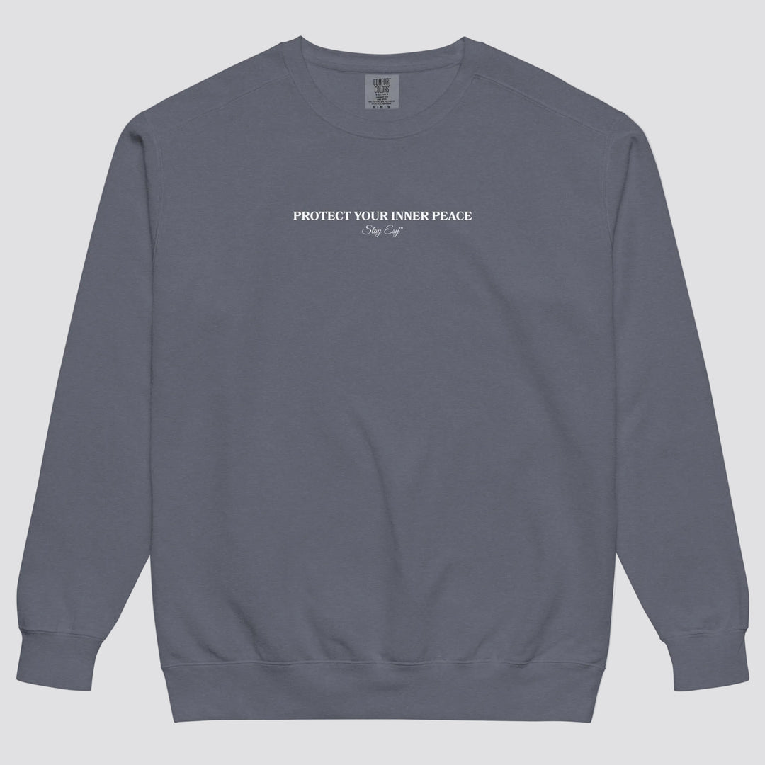 Denim unisex sweatshirt small "Protect your inner peace"graphic text in the middle of chest with "Stay Esy" trademark in script font underneath.