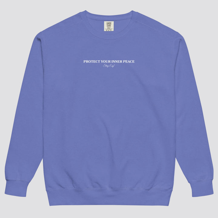 Flo Blue unisex sweatshirt small "Protect your inner peace"graphic text in the middle of chest with "Stay Esy" trademark in script font underneath.