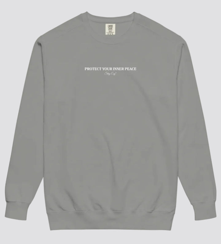 Grey unisex sweatshirt small "Protect your inner peace"graphic text in the middle of chest with "Stay Esy" trademark in script font underneath.