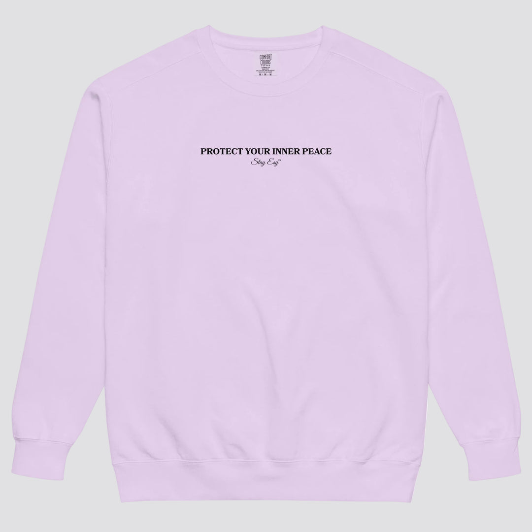 Orchid unisex sweatshirt small "Protect your inner peace"graphic text in the middle of chest with "Stay Esy" trademark in script font underneath.