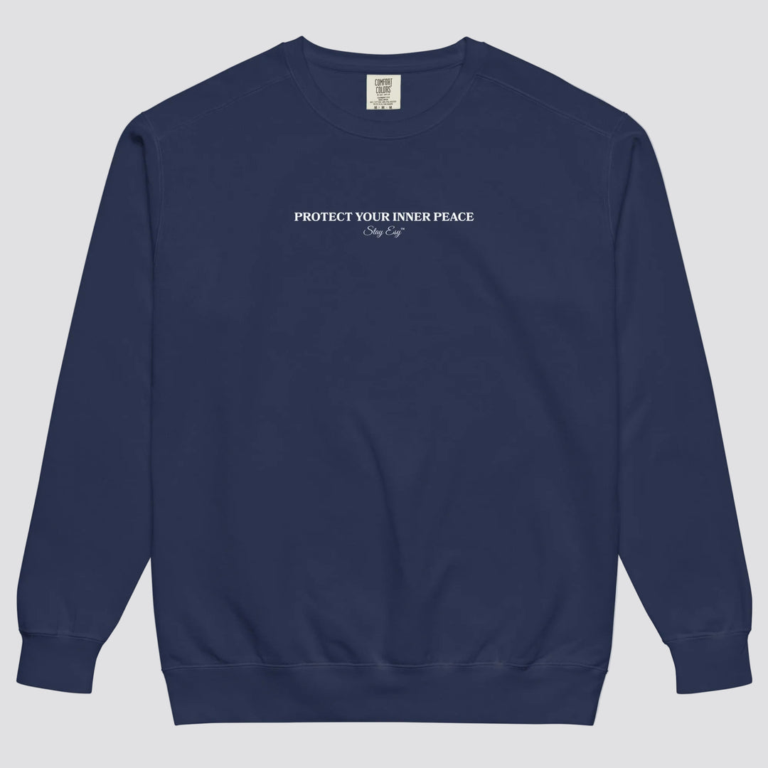 True Navy unisex sweatshirt small "Protect your inner peace"graphic text in the middle of chest with "Stay Esy" trademark in script font underneath.