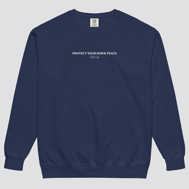 True Navy unisex sweatshirt small "Protect your inner peace"graphic text in the middle of chest with "Stay Esy" trademark in script font underneath.