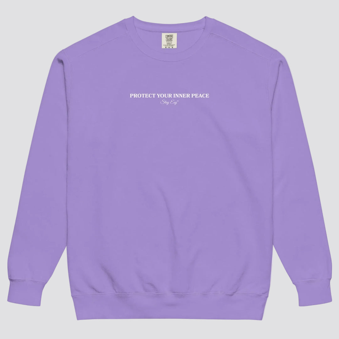 Violet unisex sweatshirt small "Protect your inner peace"graphic text in the middle of chest with "Stay Esy" trademark in script font underneath.