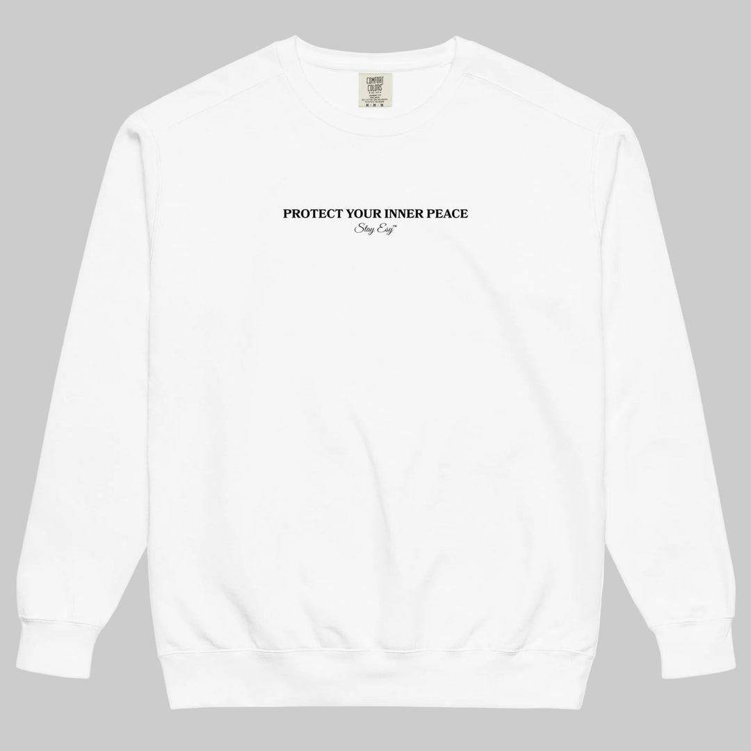 White unisex sweatshirt small "Protect your inner peace"graphic text in the middle of chest with "Stay Esy" trademark in script font underneath.