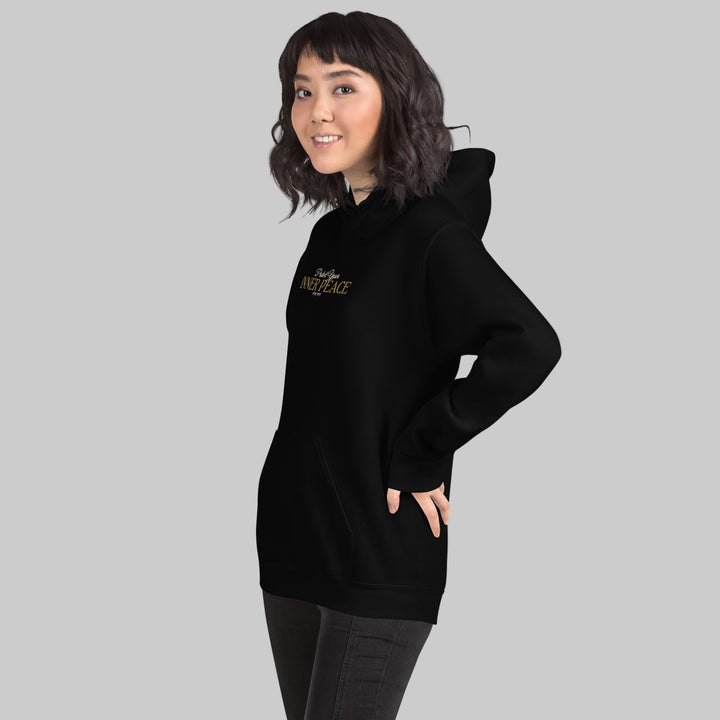 Person wearing a black hoodie with text on a white background