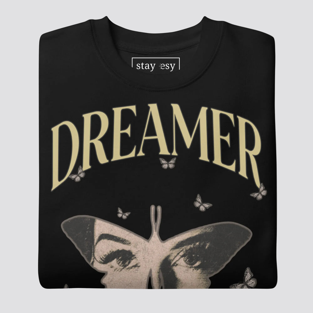 Black sweatshirt with 'Dreamer' text and butterfly design on a white background