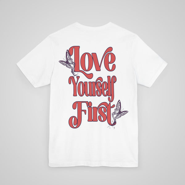 Back view of Love Yourself First Lightweight Tee in white, featuring a self-care and mental health awareness design.