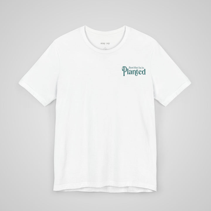 Front view of white mental health apparel t-shirt with Bloom Where You Are Planted print